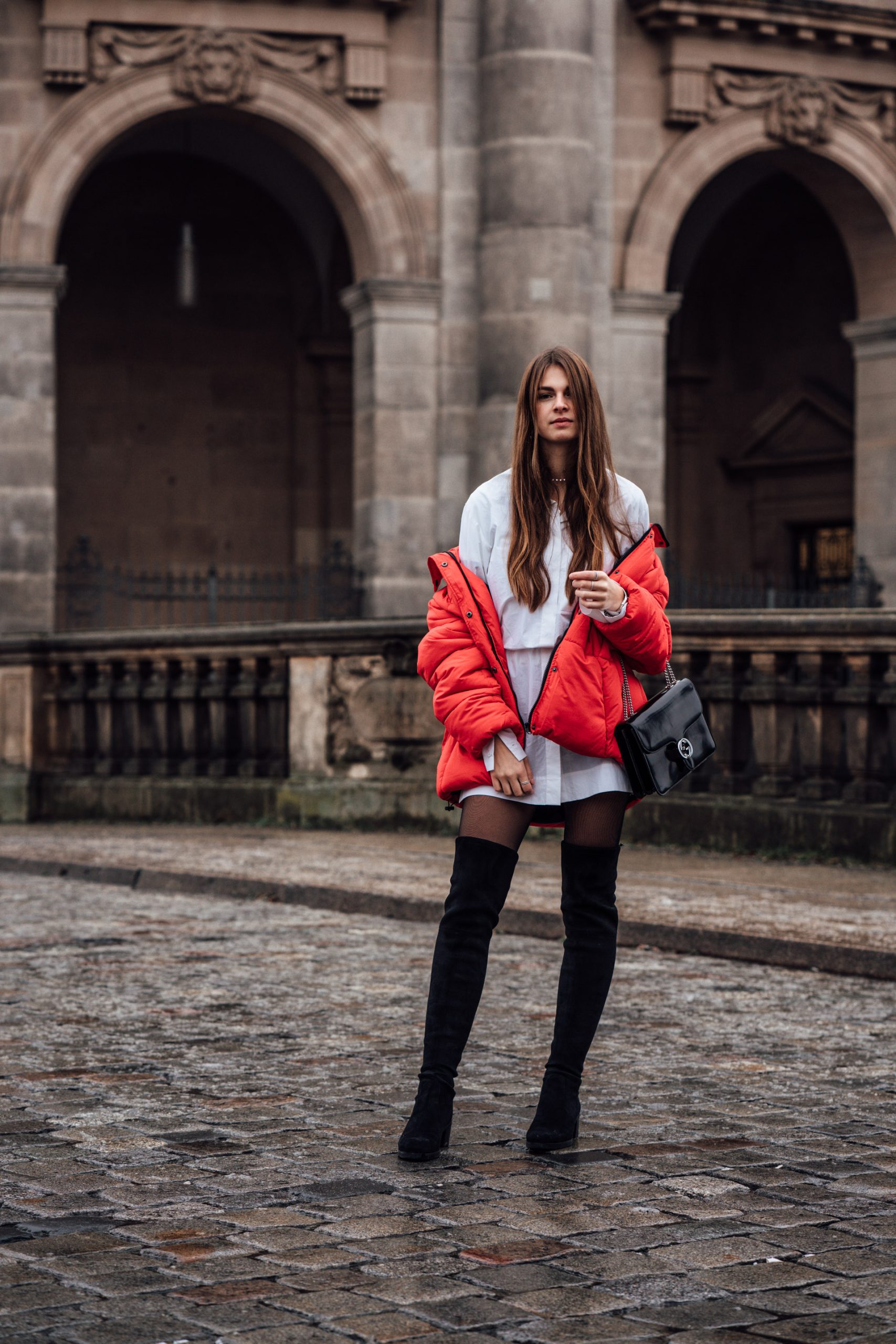 Red Puffer Jacket Worn Off-Shoulder with Mini Dress — Long Puffer Coat Outfits