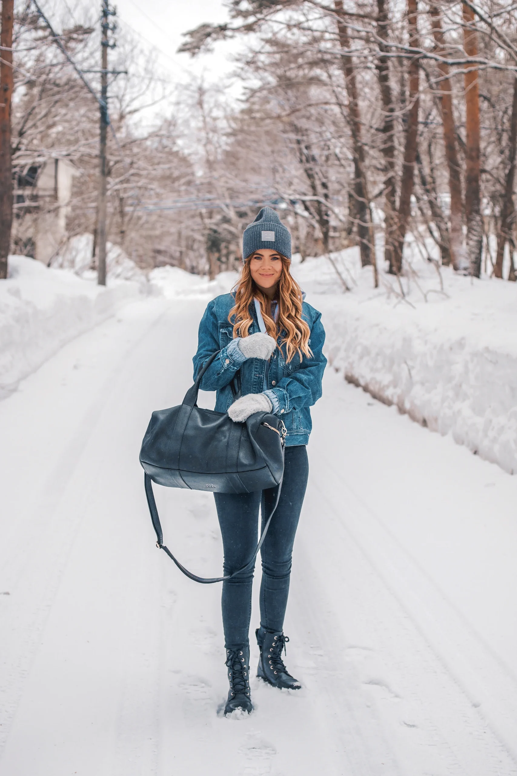 Denim Jacket Over Hoodie with Skinny Jeans for Winter Travel — Japan Winter Outfits