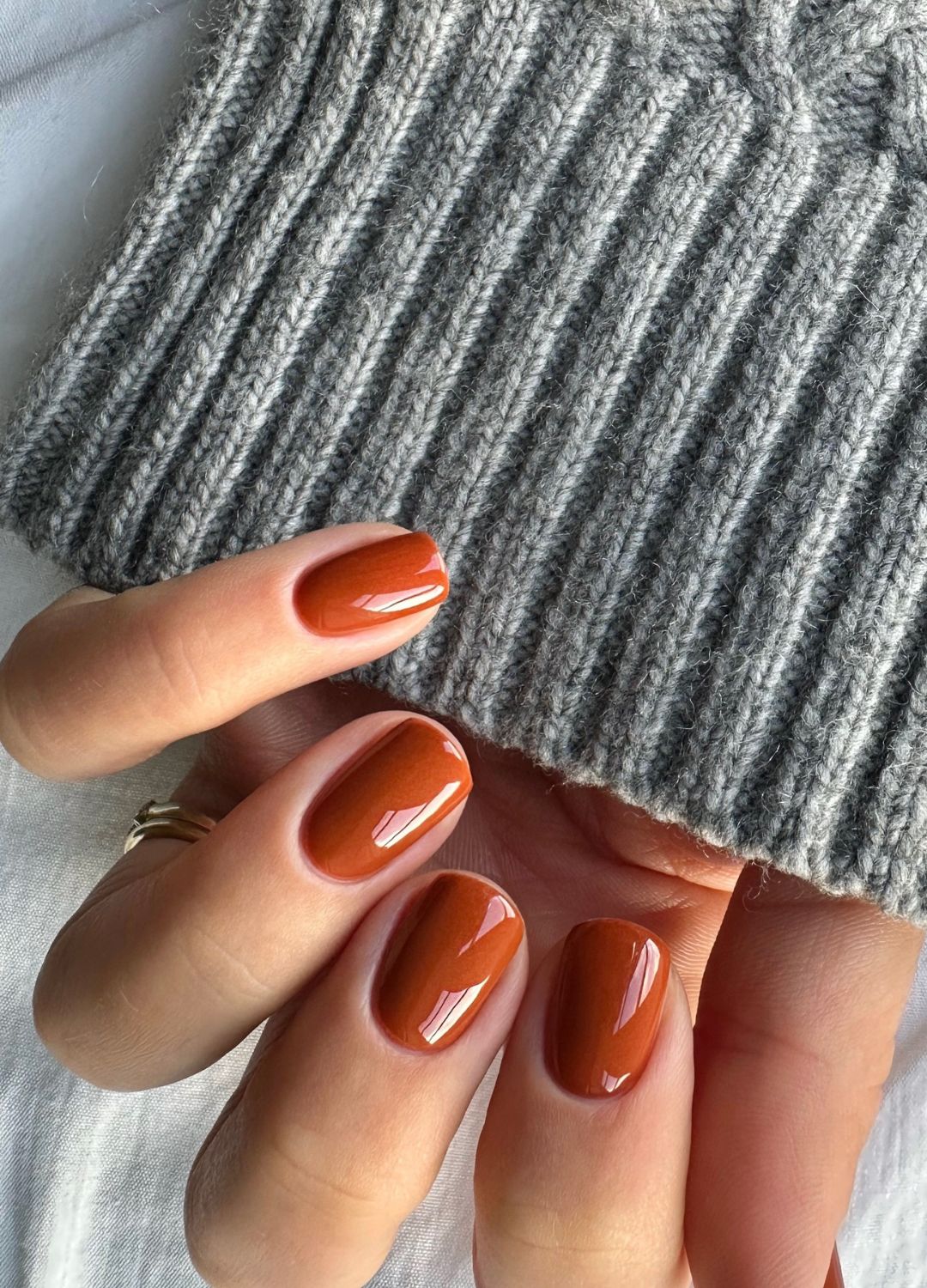 Glossy Terracotta Orange Short Oval Nails Glossy Terracotta Orange Short Oval Nails — Winter Nail Colors for Pale Skin