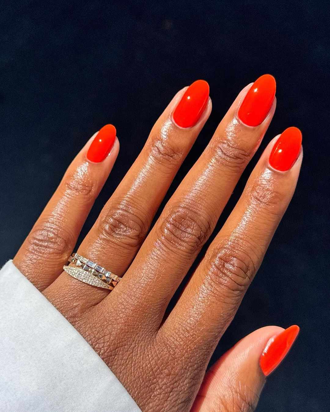 Vibrant Orange-Red Glossy Medium Almond Nails Vibrant Orange-Red Glossy Medium Almond Nails — Winter Nail Colors for Dark Skin