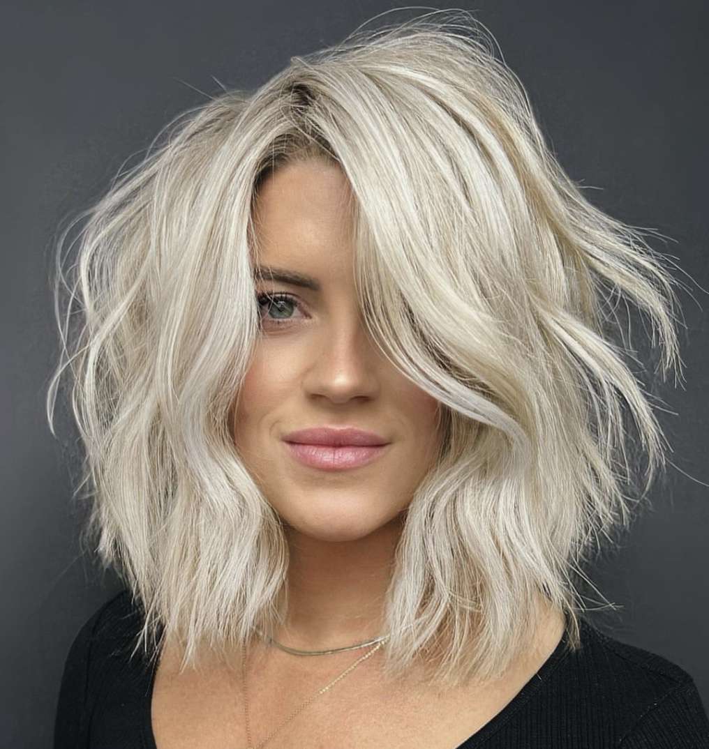 Messy Ash Blonde Bob With Bangs Messy Ash Blonde Bob With Bangs — Winter Haircuts for Thick Hair
