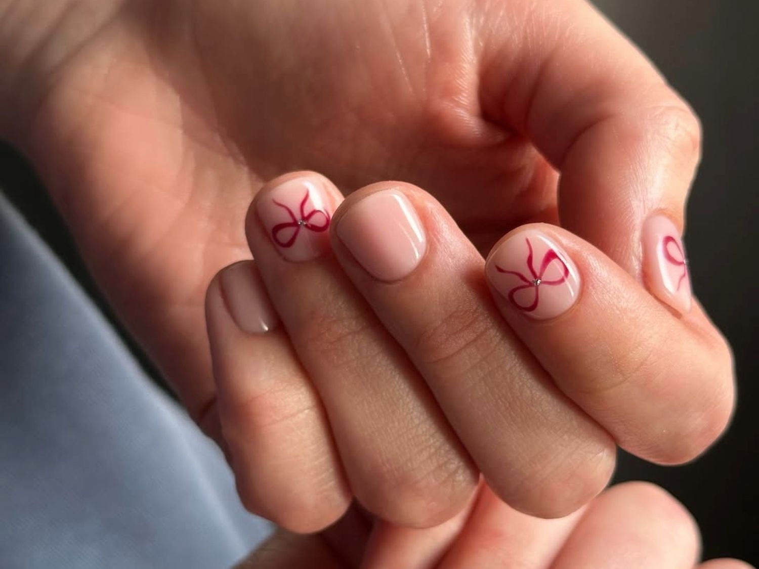 Sheer Nude with Red Bows Sheer Nude with Red Bows — Short Winter Acrylic Nails