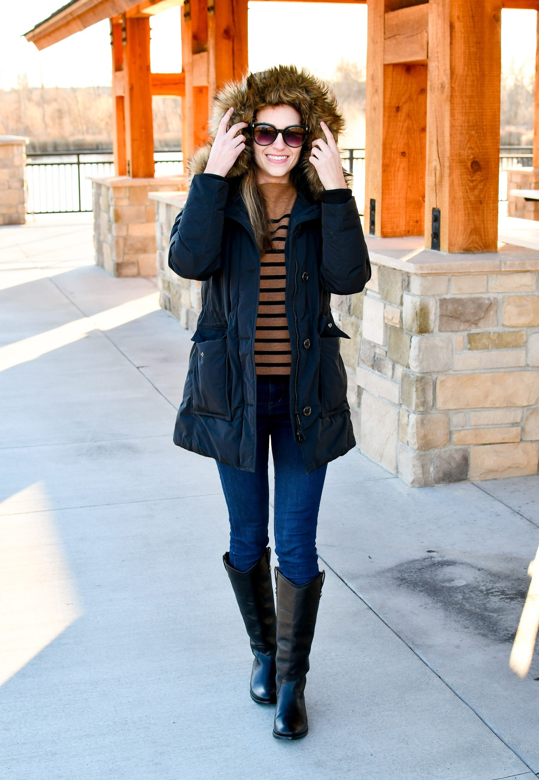 Dark Fur-Lined Parka with Striped Sweater and Knee-High Boots Dark Fur-Lined Parka with Striped Sweater and Knee-High Boots — Parka Outfits