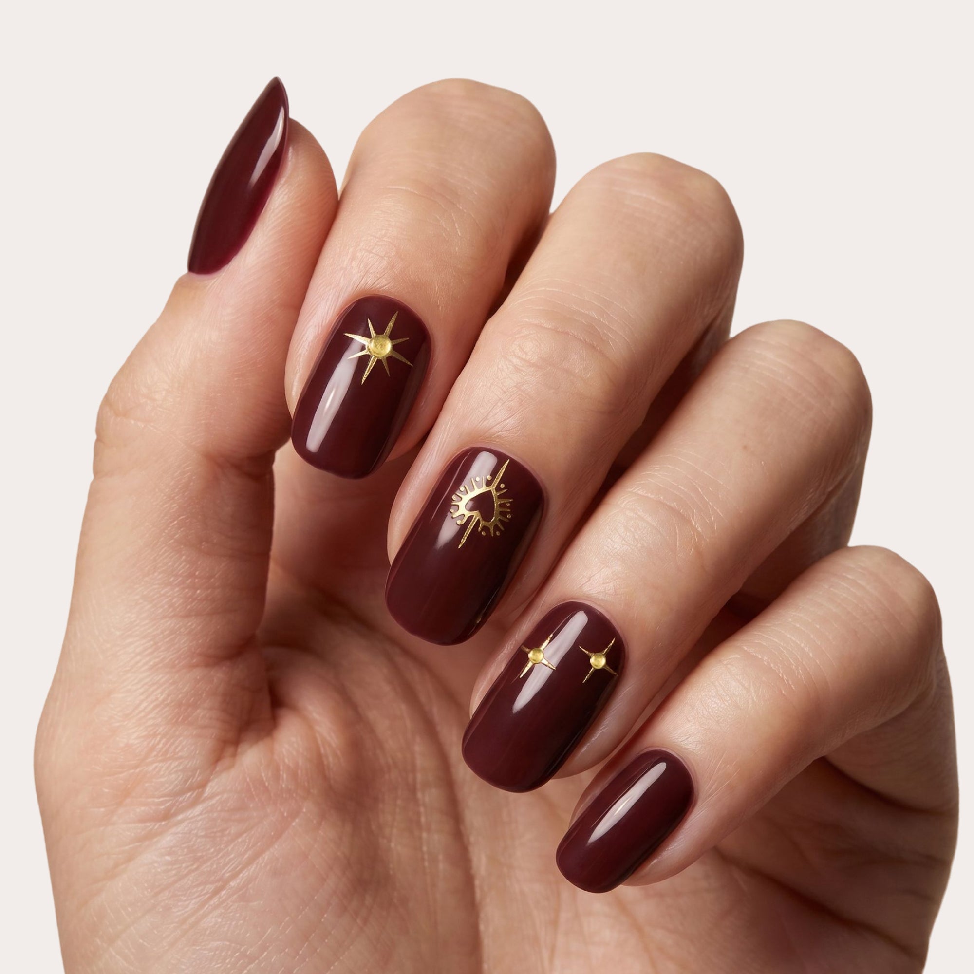 Burgundy with Gold Celestial Motifs Burgundy with Gold Celestial Motifs — Burgundy Nails