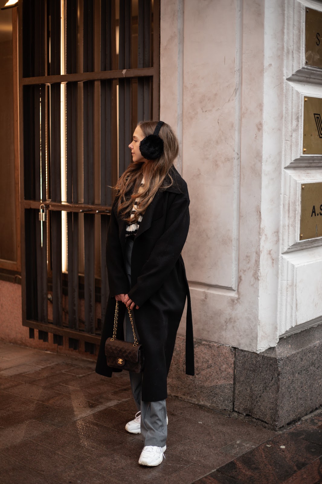Casual Monochrome: Black Earmuffs with Striped Sweater and Coat Casual Monochrome: Black Earmuffs with Striped Sweater and Coat — Earmuffs Outfits