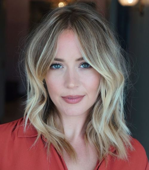 Blonde Layered Lob with Side-Swept Bangs Blonde Layered Lob with Side-Swept Bangs — Winter Haircuts for Oval Faces