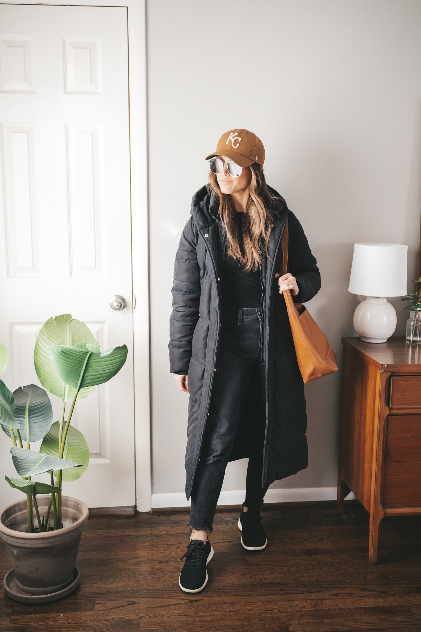 Long Black Puffer Coat with Baseball Cap — Late Winter Outfits