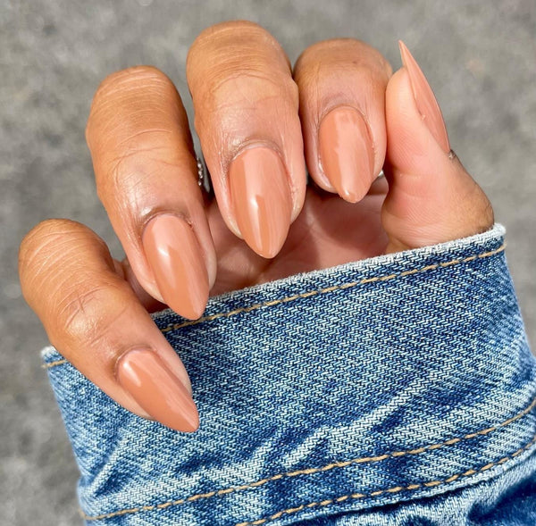 Medium Nude Warm Undertones Glossy Almond Nails Medium Nude Warm Undertones Glossy Almond Nails — Winter Nail Colors for Dark Skin