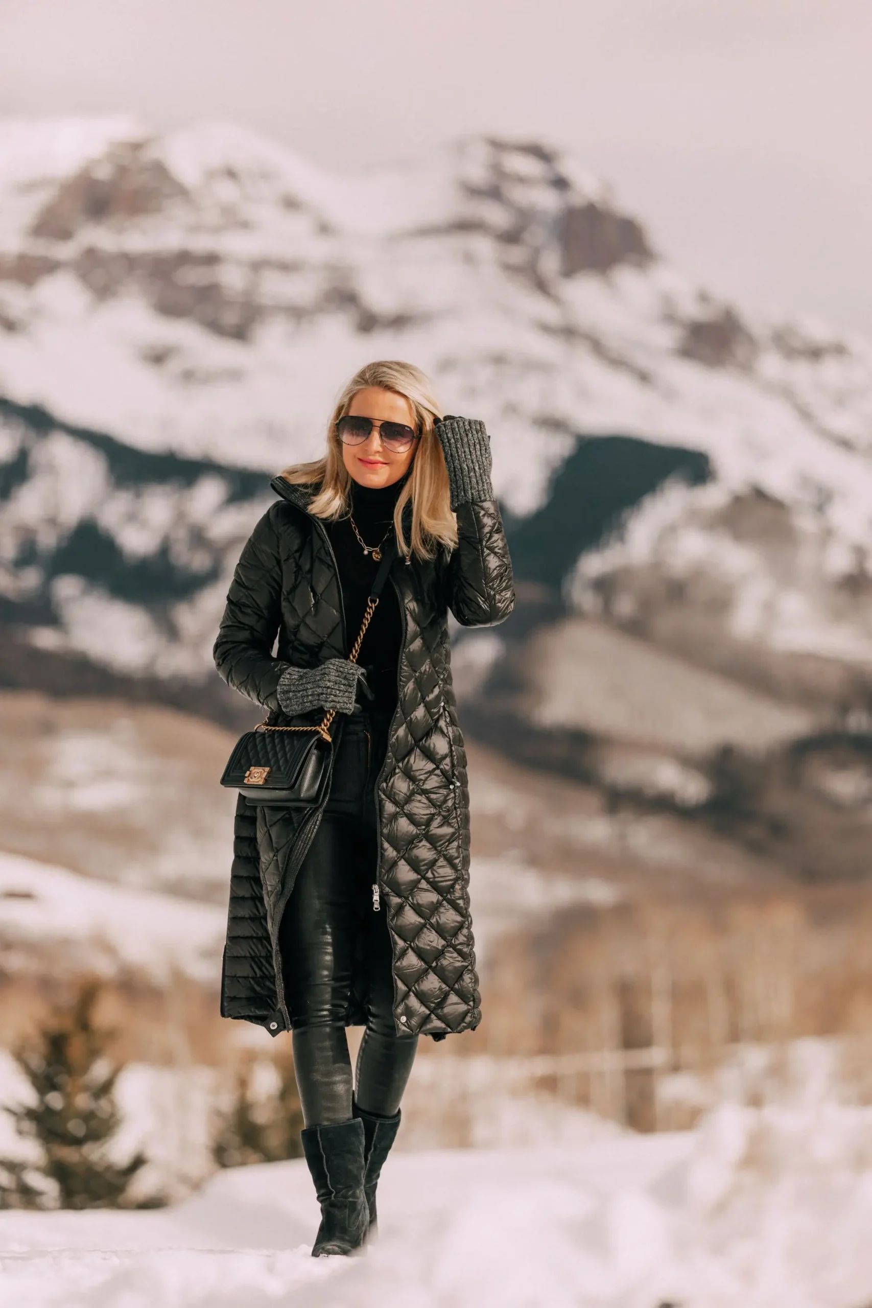 Quilted Black Puffer with Leather Pants and Knee-High Boots — Long Puffer Coat Outfits