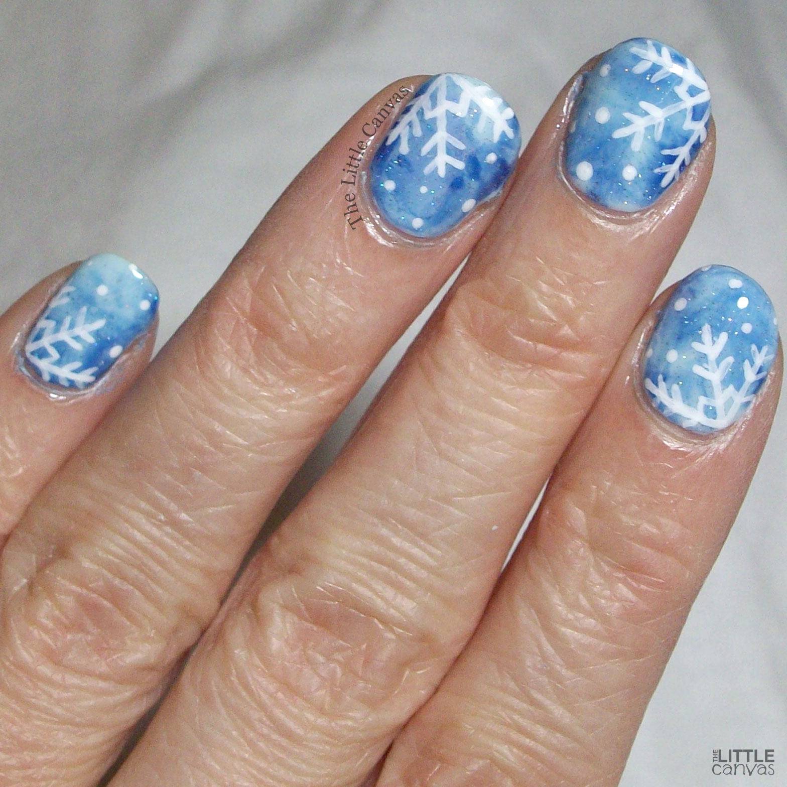 Glossy Blue Gradient with White Snowflakes Glossy Blue Gradient with White Snowflakes — Winter Nails for Kids