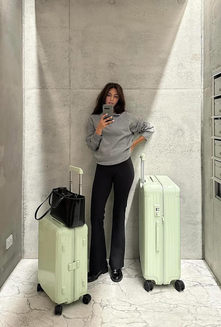 Comfortable Grey Sweatshirt with Flared Black Pants — Winter Airport Outfits