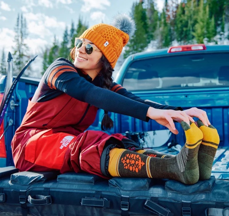 Vibrant Red Ski Bib Paired with a Base Layer and Patterned Socks Vibrant Red Ski Bib Paired with a Base Layer and Patterned Socks — Snowboarding Outfits