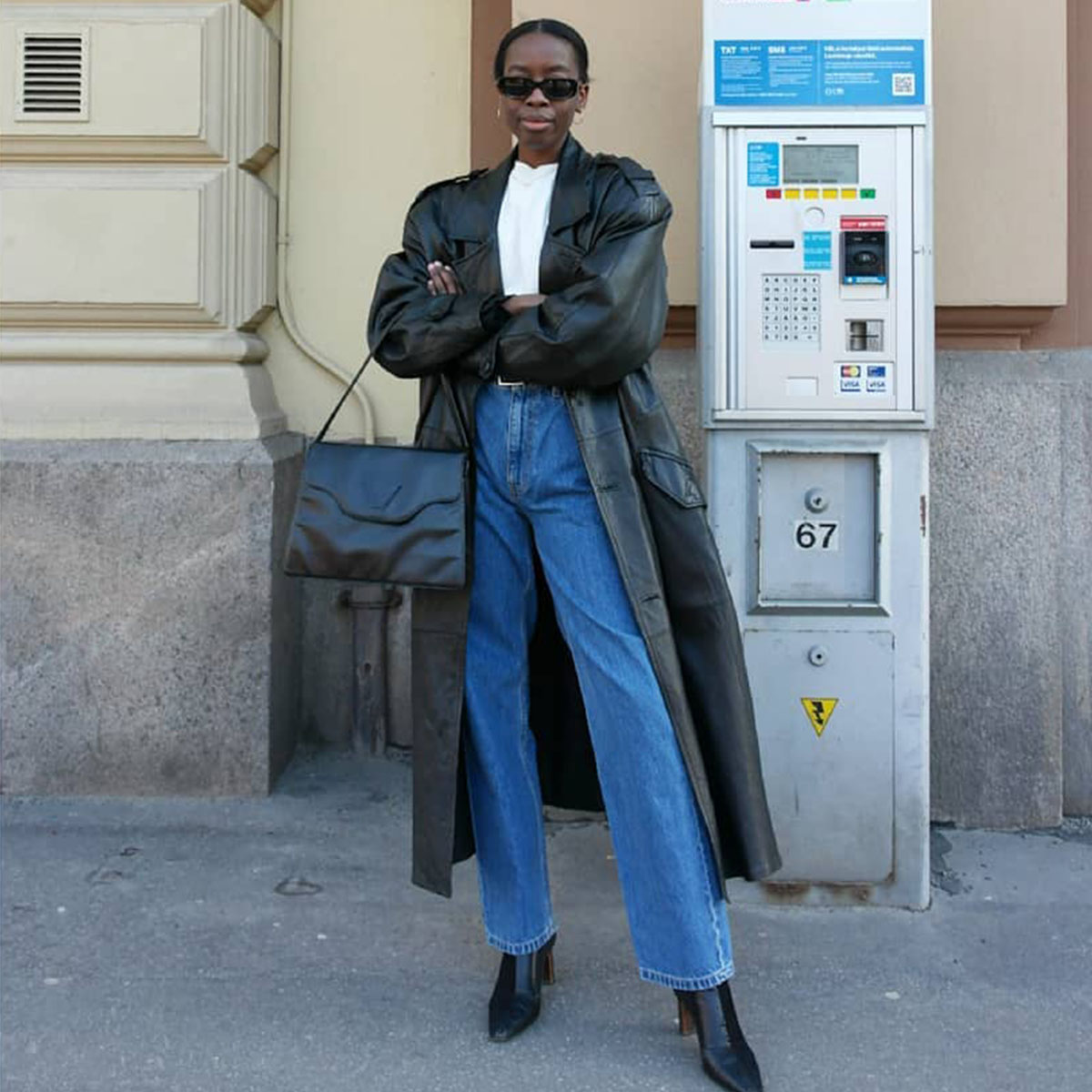 Streetwear Style: Black Leather Trench, White Shirt, and Blue Jeans — Black Boots Outfits