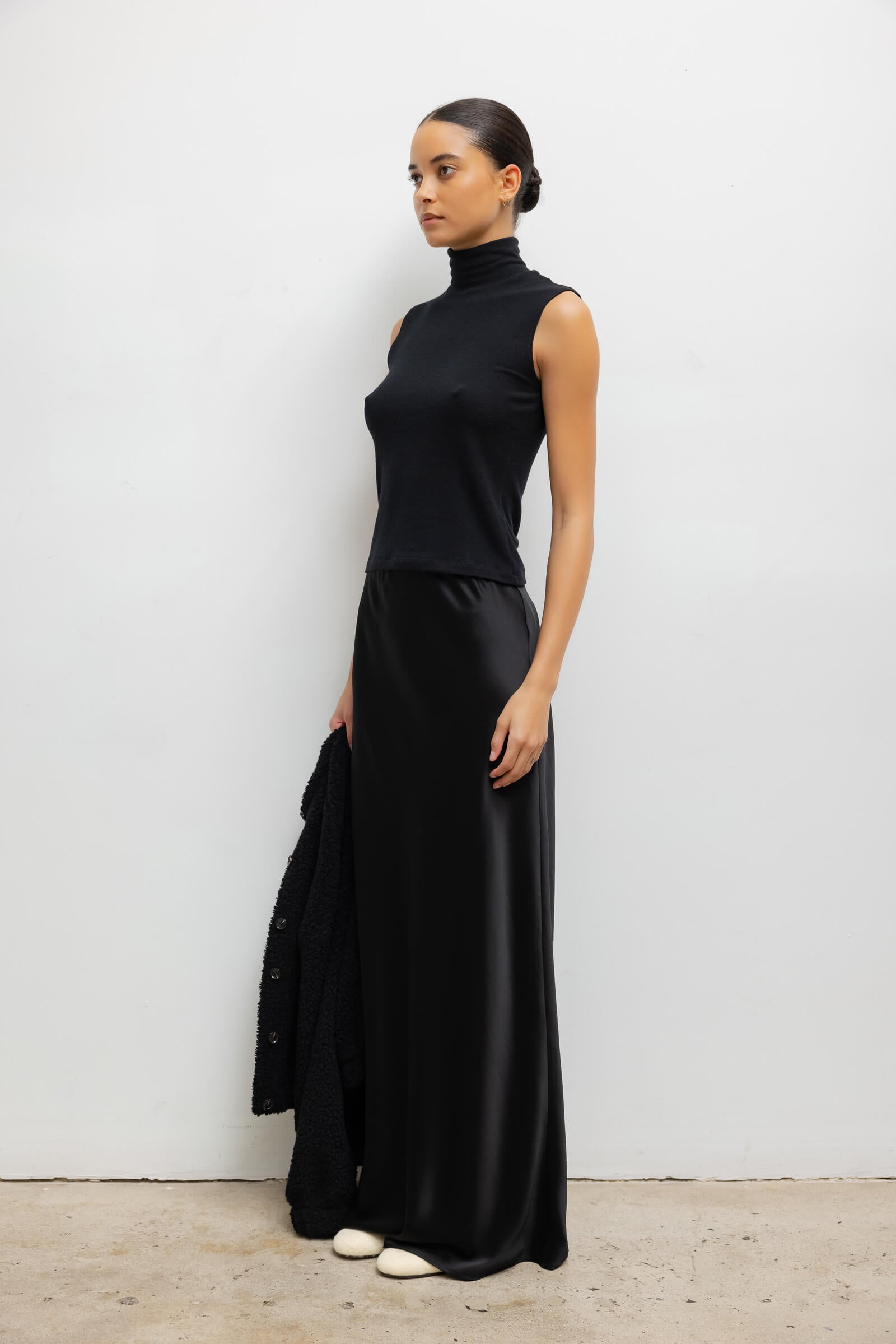 Sleek Black Sleeveless Turtleneck with Flowing Satin Maxi Skirt — Turtleneck Outfits