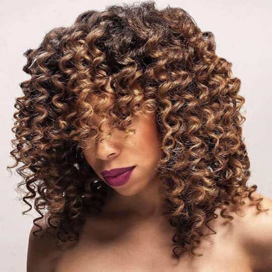 Long Curly Hair With Full Bangs — Winter Haircuts for Curly Hair