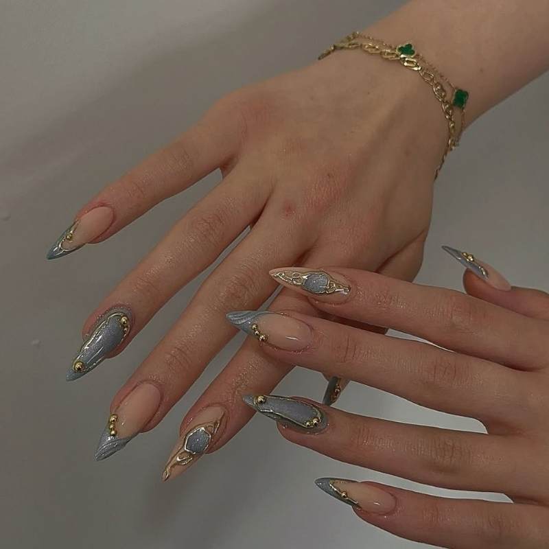 Nude Stiletto With Abstract Gold Swirls Nude Stiletto With Abstract Gold Swirls — Winter Stiletto Nails