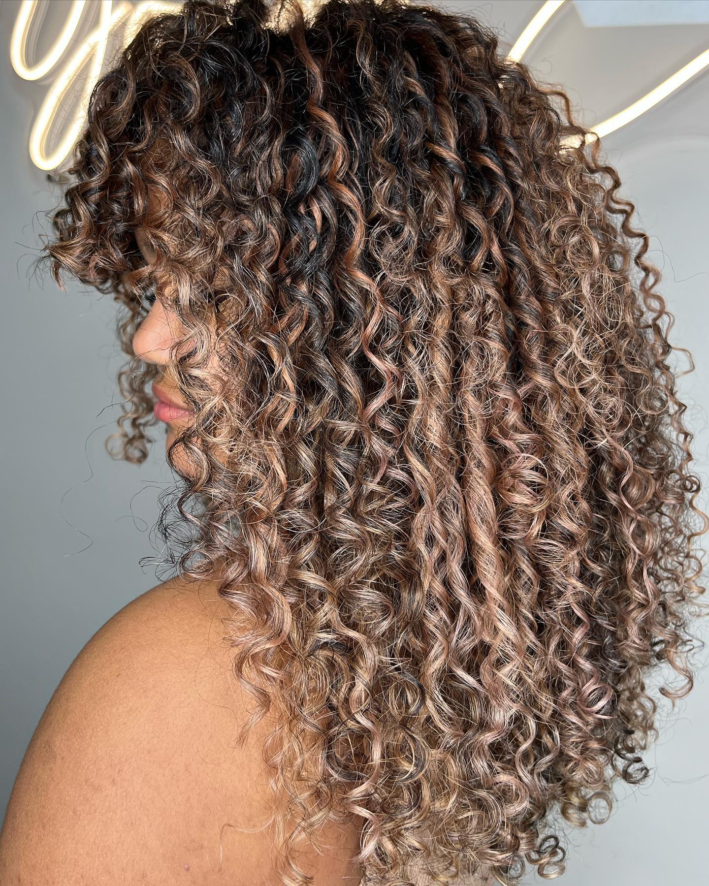Dark Brown With Caramel Highlights Side View — Winter Hair Colors for Curly Hair