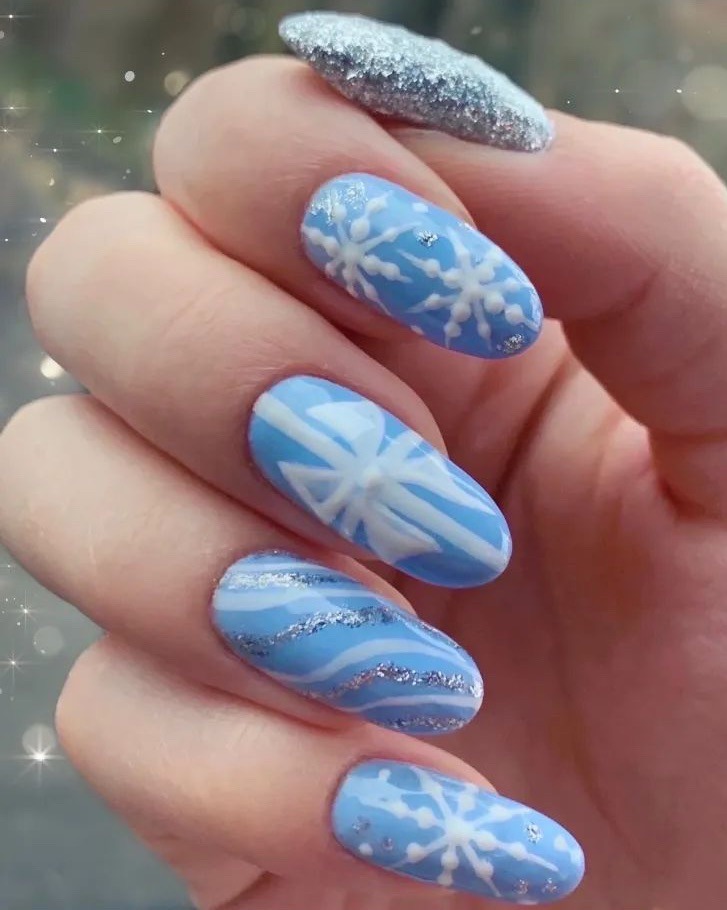 Light Blue Oval Nails with Wavy Lines and Snowflakes Light Blue Oval Nails with Wavy Lines and Snowflakes — Winter Gel Nails