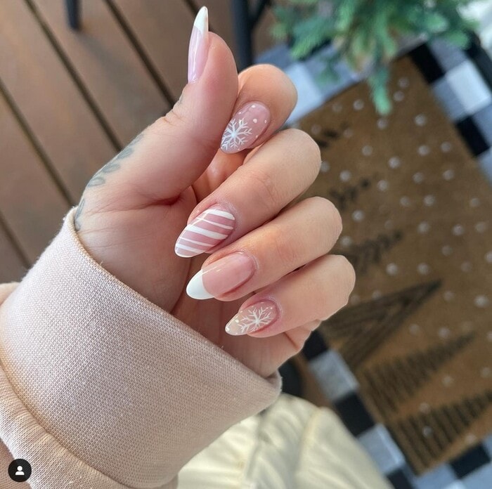 One Hand Close-Up Medium Almond Pale Pink Snowflakes Stripes French One Hand Close-Up Medium Almond Pale Pink Snowflakes Stripes French — Winter White Nails