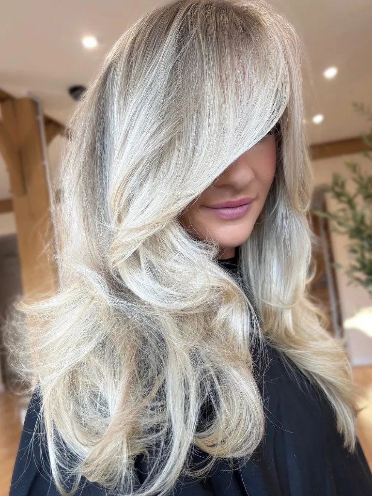 Voluminous Platinum Blonde With Side Bangs Voluminous Platinum Blonde With Side Bangs — True Winter Hair Color
