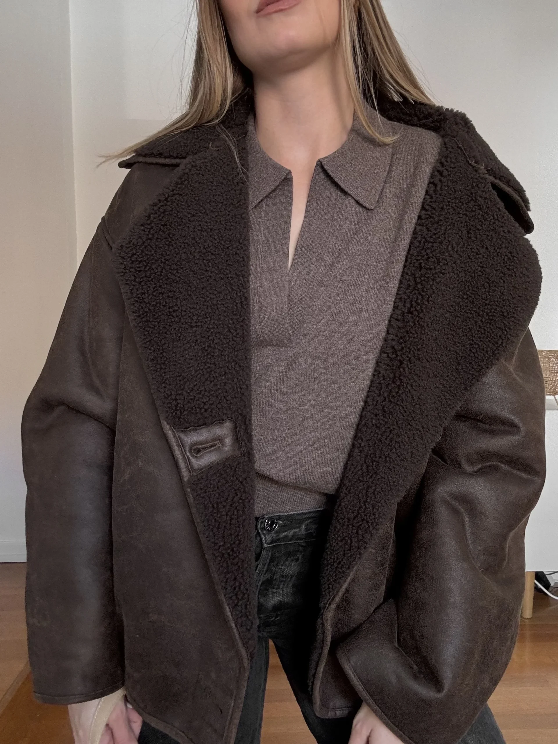 Shearling-Lined Jacket Over Collared Knit Top — Winter to Spring Transition Outfits