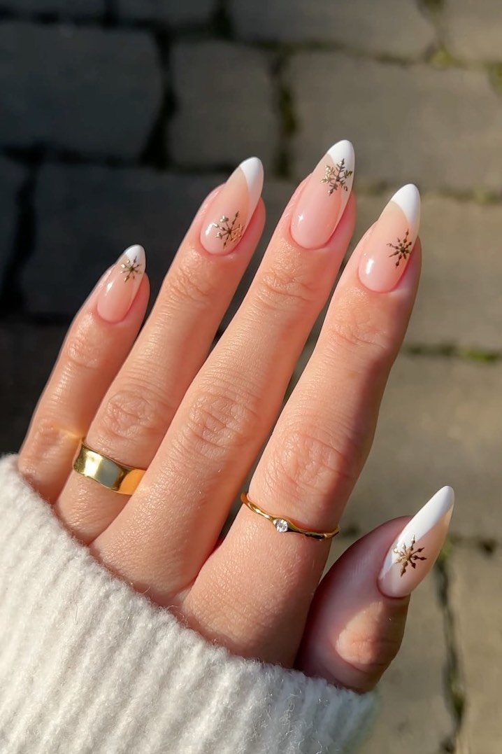 French Manicure with Gold Snowflake Accents French Manicure with Gold Snowflake Accents — Winter Nail Colors for Women Over 50