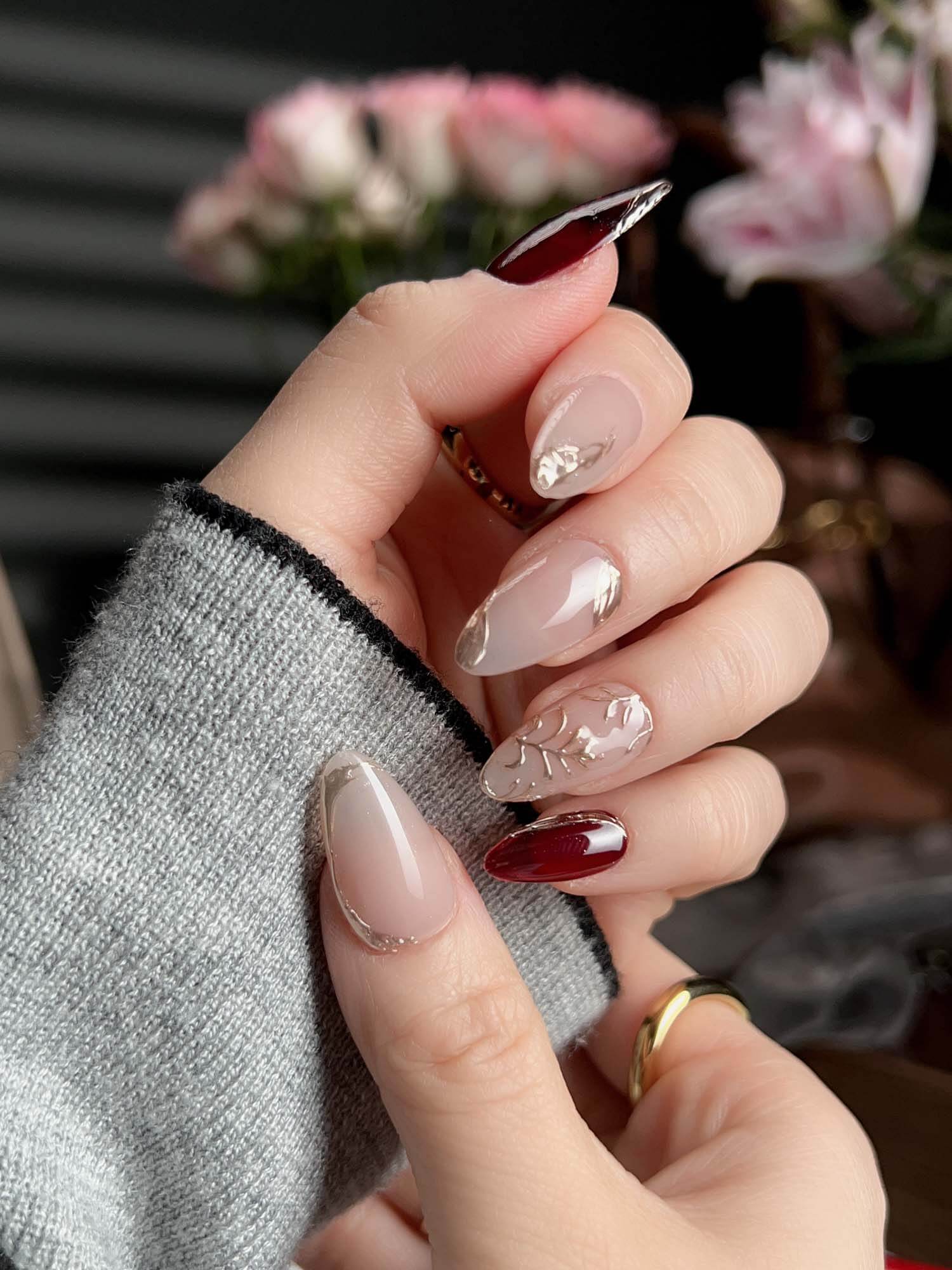 Sheer Nude Almonds with Burgundy Tips and Gold Leaf Sheer Nude Almonds with Burgundy Tips and Gold Leaf — Burgundy Nails
