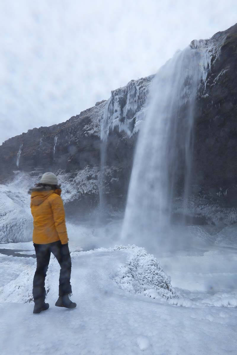 Bright Yellow Waterproof Jacket for Icy Landscapes — Iceland Winter Outfits