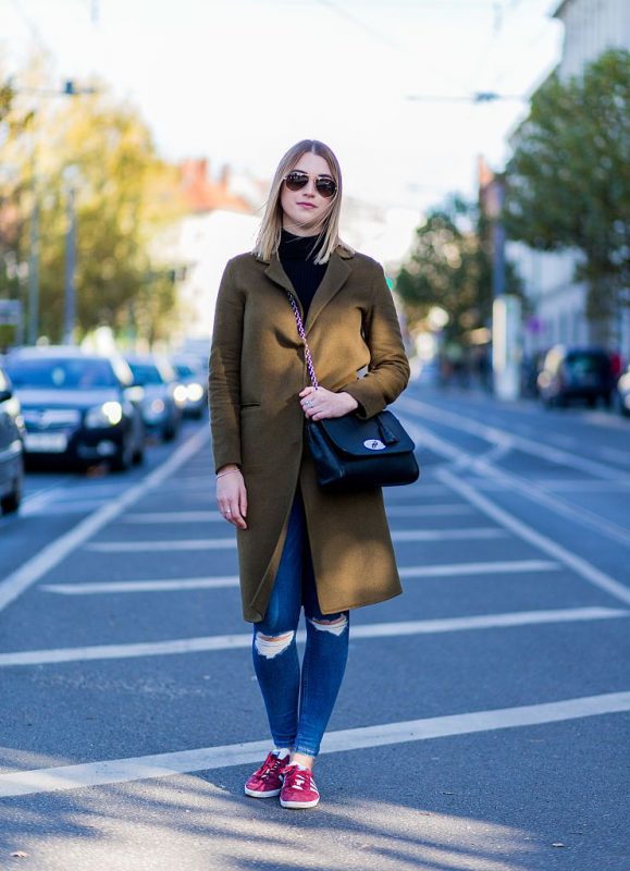 Olive Green Wool Coat with Ripped Jeans and Red Sneakers Olive Green Wool Coat with Ripped Jeans and Red Sneakers — Winter Outfits for Warm Weather