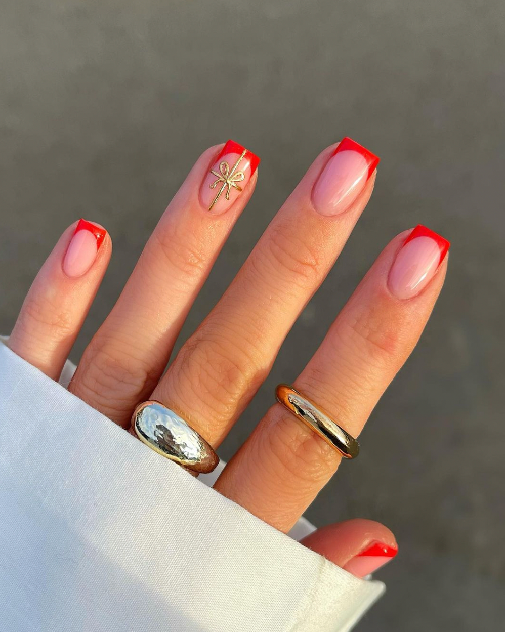 Red French Tip with Gold Bow Red French Tip with Gold Bow — Winter Nail Colors for Women Over 40