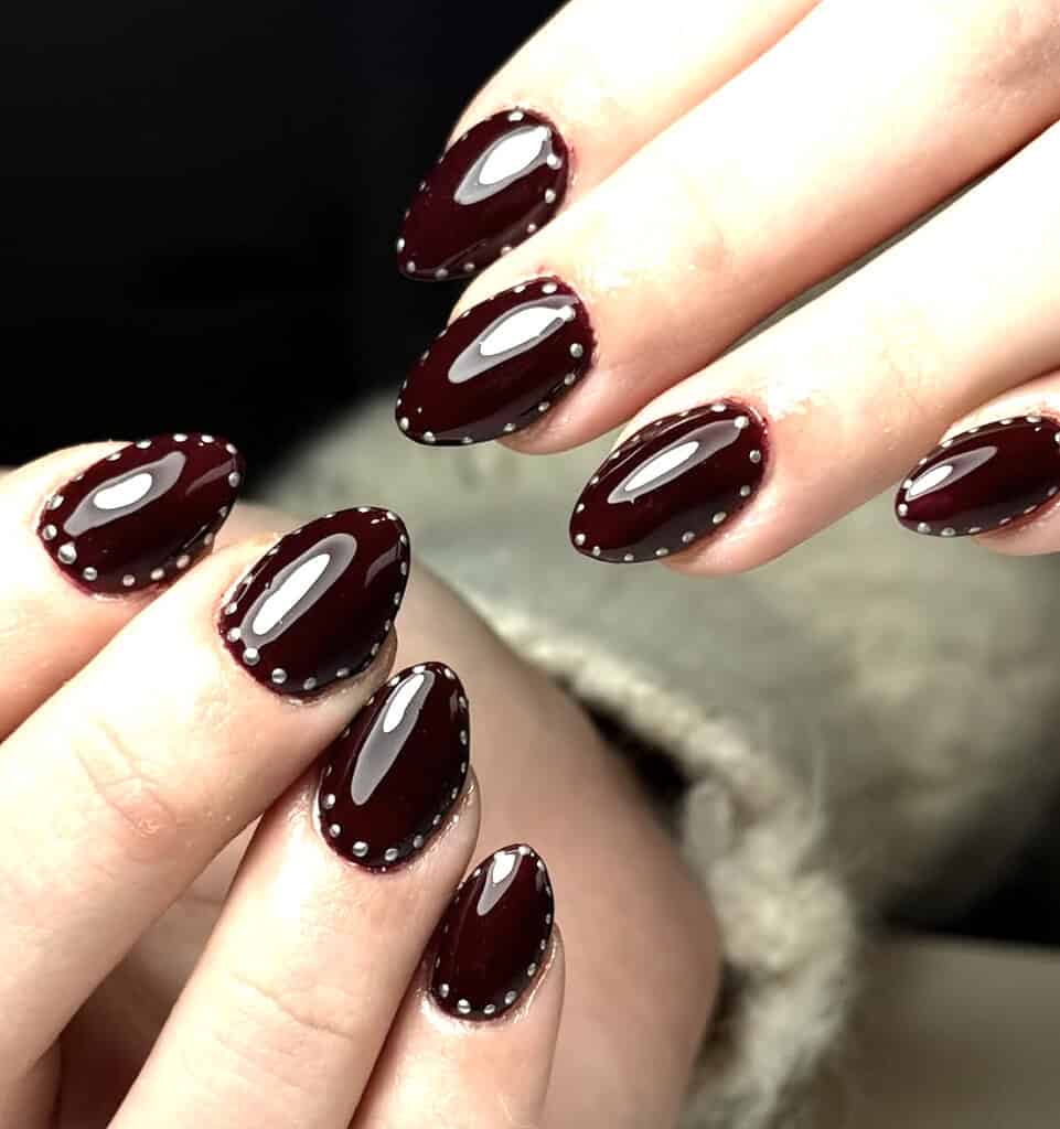 Burgundy Nails with Silver Stud Accents Burgundy Nails with Silver Stud Accents