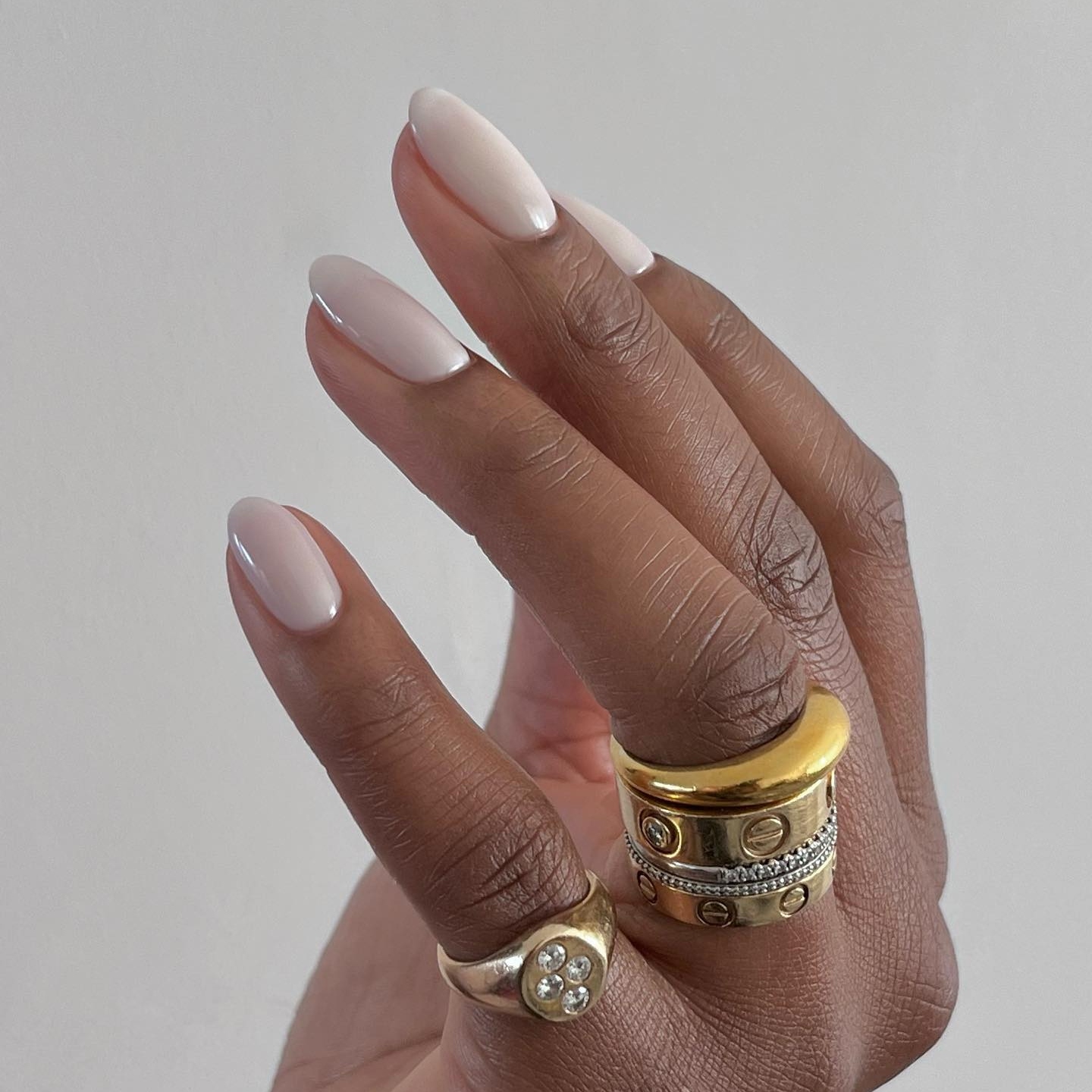 Pale Cool Nude Glossy Long Oval Nails Pale Cool Nude Glossy Long Oval Nails — Winter Nail Colors for Dark Skin