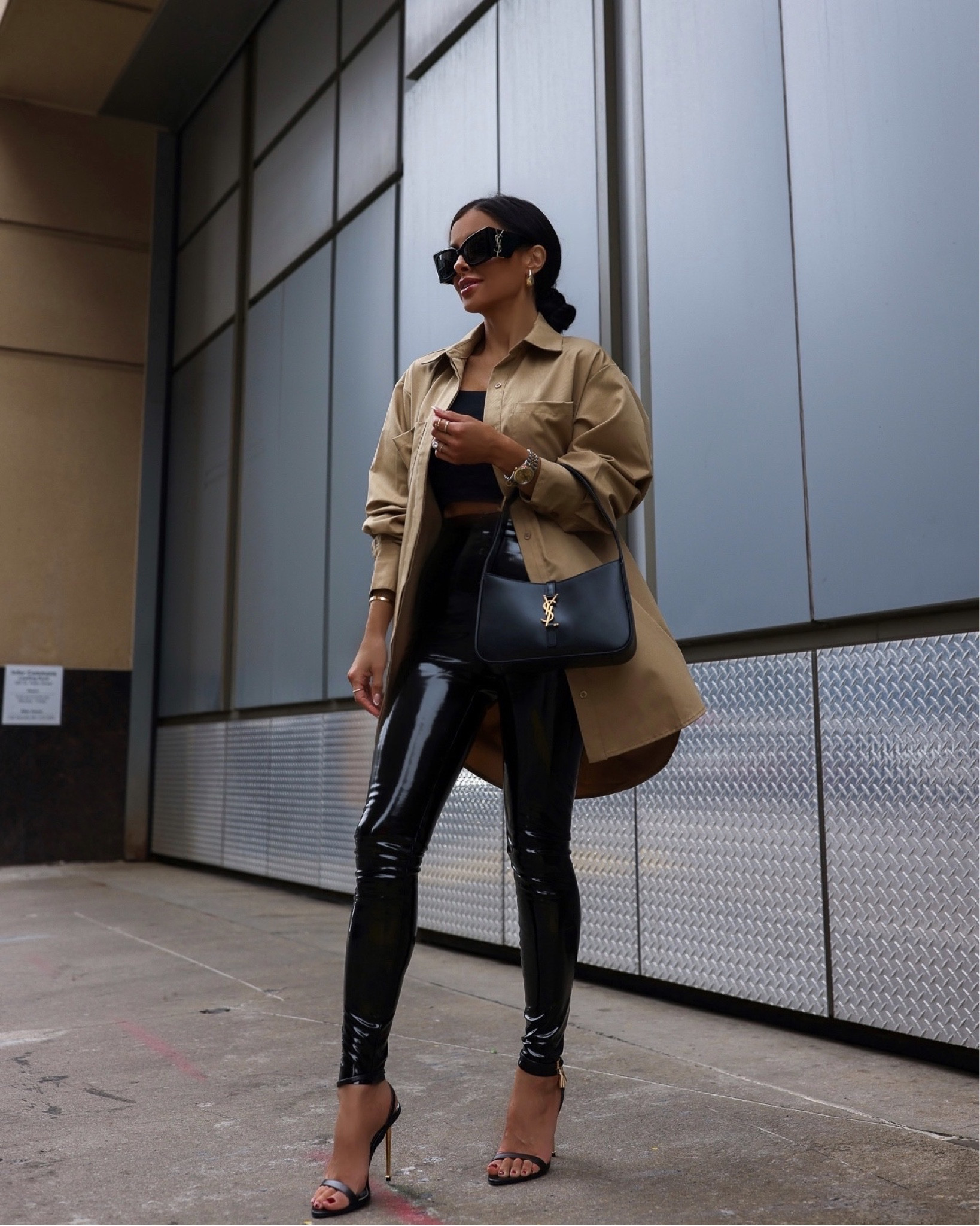 Shiny Vinyl Pants Elevate a Black Crop Top and Tan Shirt for a Night Out Shiny Vinyl Pants Elevate a Black Crop Top and Tan Shirt for a Night Out — Winter Concert Outfits