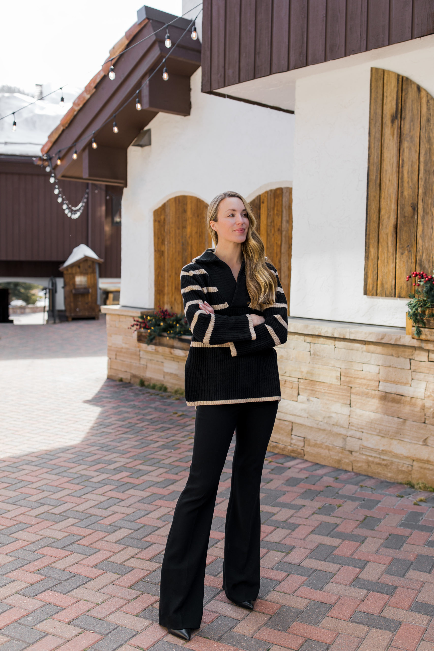 Chic Black and Beige Striped Knit Sweater with Wide-Leg Pants Chic Black and Beige Striped Knit Sweater with Wide-Leg Pants — Apres Ski Outfits