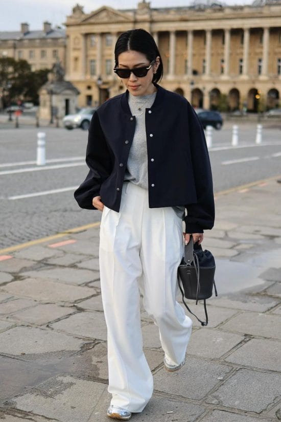Navy Bomber Jacket with White Wide-Leg Trousers and Silver Sneakers — Paris Winter Outfits
