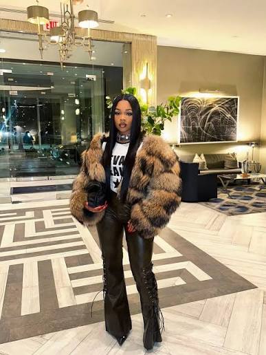 Edgy Statement: Oversized Faux Fur Jacket with Flared Pants for a Winter Birthday — Winter Birthday Outfits