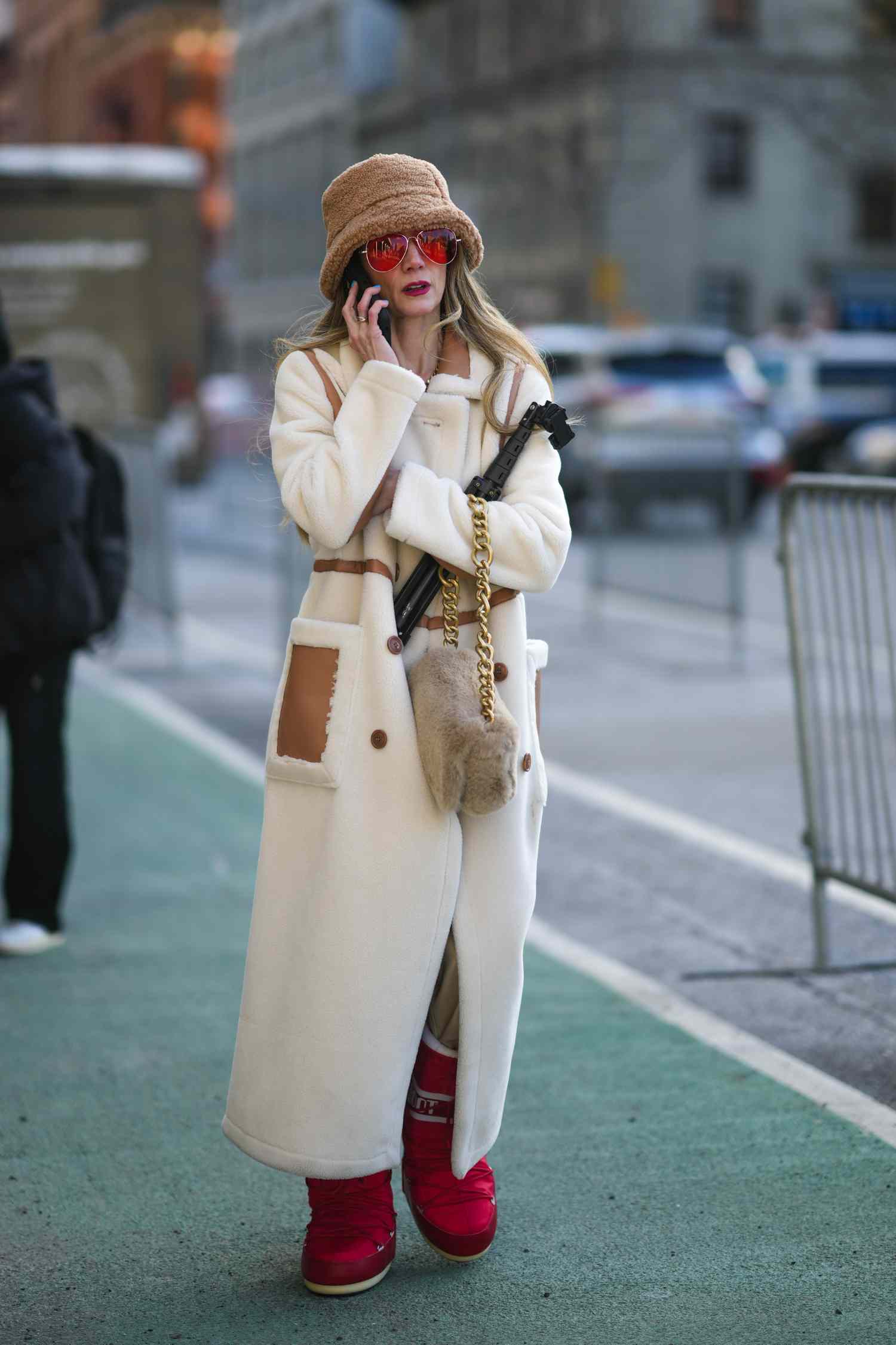 Shearling-Lined Coat and Bright Red Moon Boots for a Playful Snow Day — Snow Day Outfits