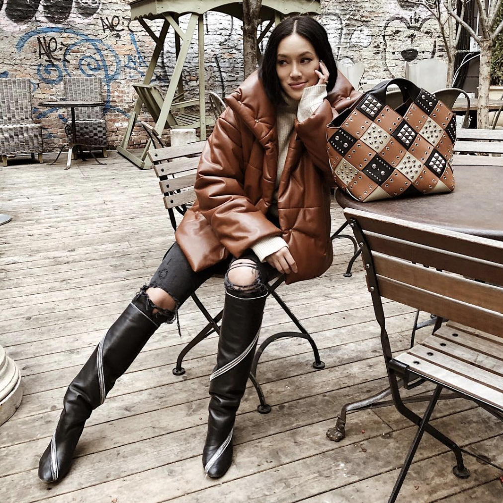 Winter Casual: Black Knee-High Boots with Puffer Jacket and Ripped Jeans — Black Boots Outfits