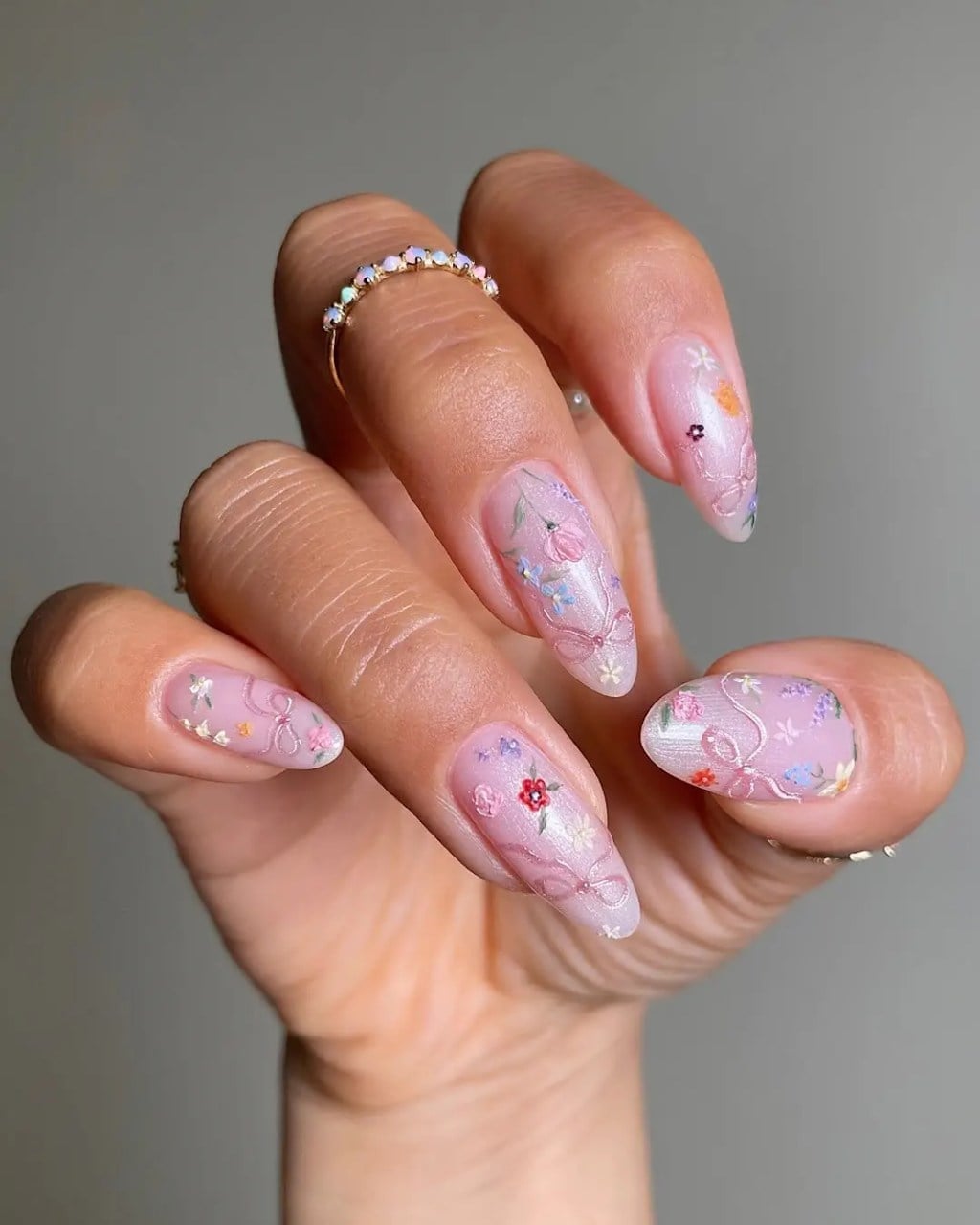 Sheer Pink Floral Bow Almond Nails, Close-Up Take Sheer Pink Floral Bow Almond Nails, Close-Up Take — Aesthetic Nails
