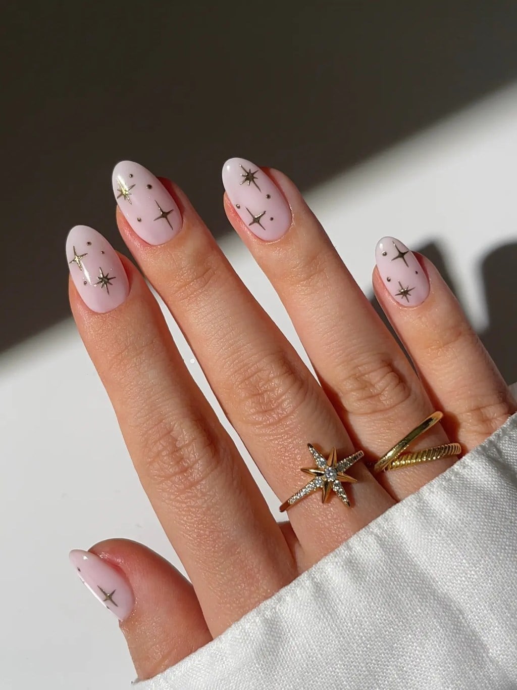 Soft Pink with Gold Star Medium Almond Nails