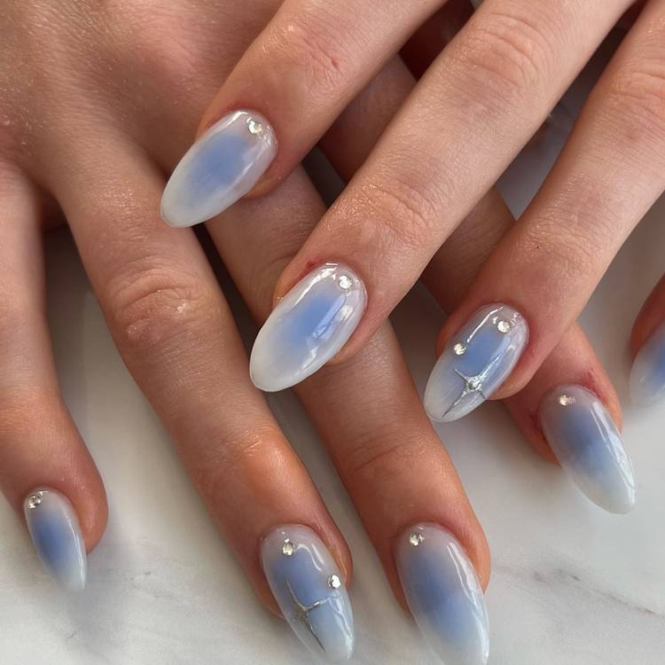 Milky Blue Aura with Rhinestones and Silver Lines Medium Oval Nails Milky Blue Aura with Rhinestones and Silver Lines Medium Oval Nails — Aura Nails