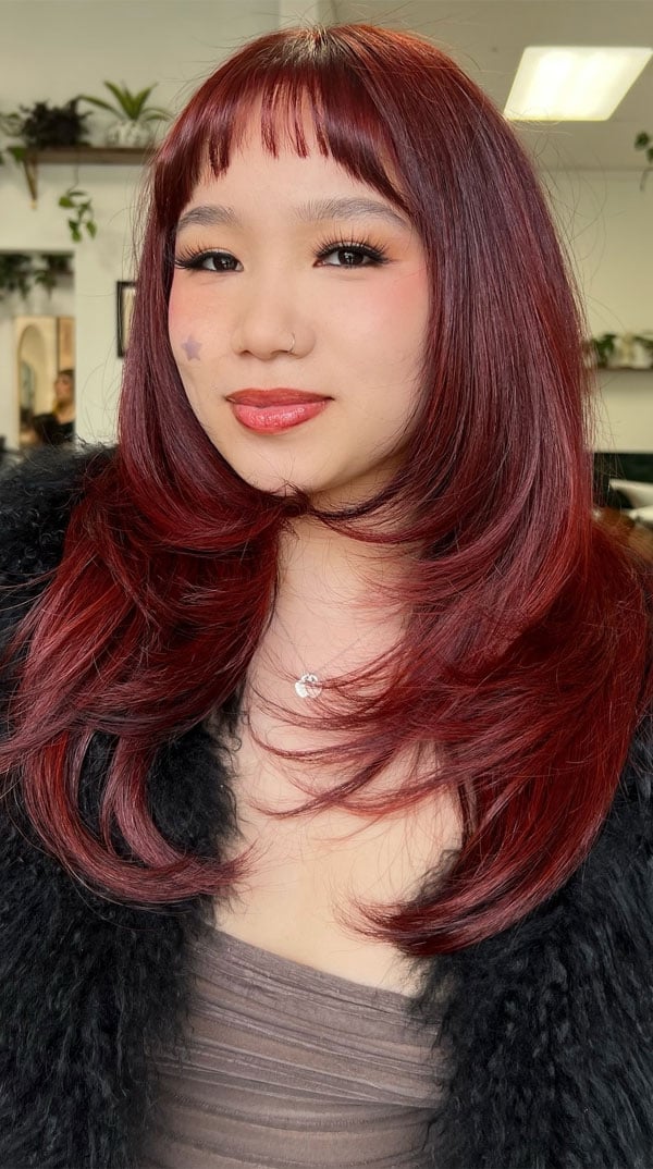 Mid Back Red Hair With Baby Bangs and Highlights