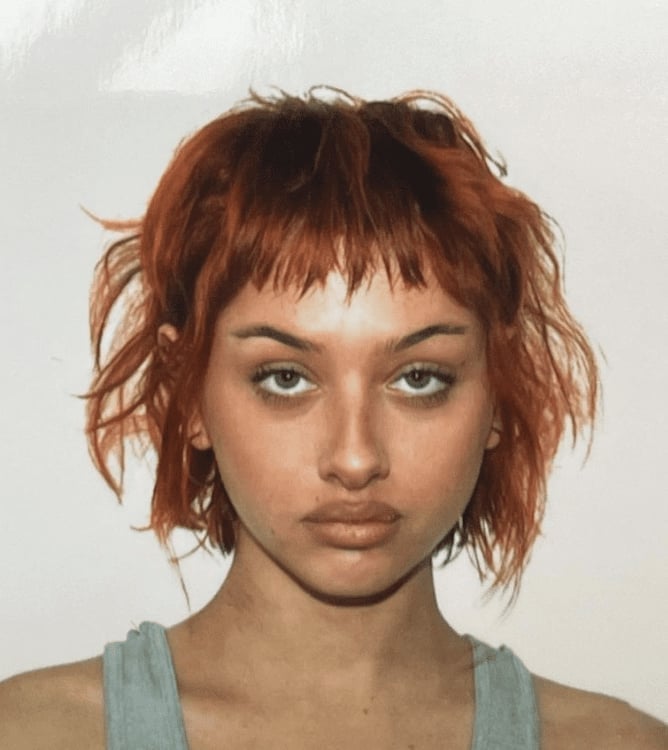 Short Choppy Red Shag With Piecey Baby Bangs