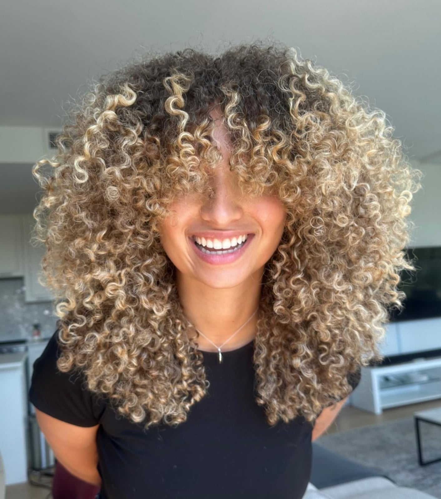 Mid-Back Curly Hair With Honey Blonde Balayage and Curtain Bangs Mid-Back Curly Hair With Honey Blonde Balayage and Curtain Bangs — Balayage Curly Hair