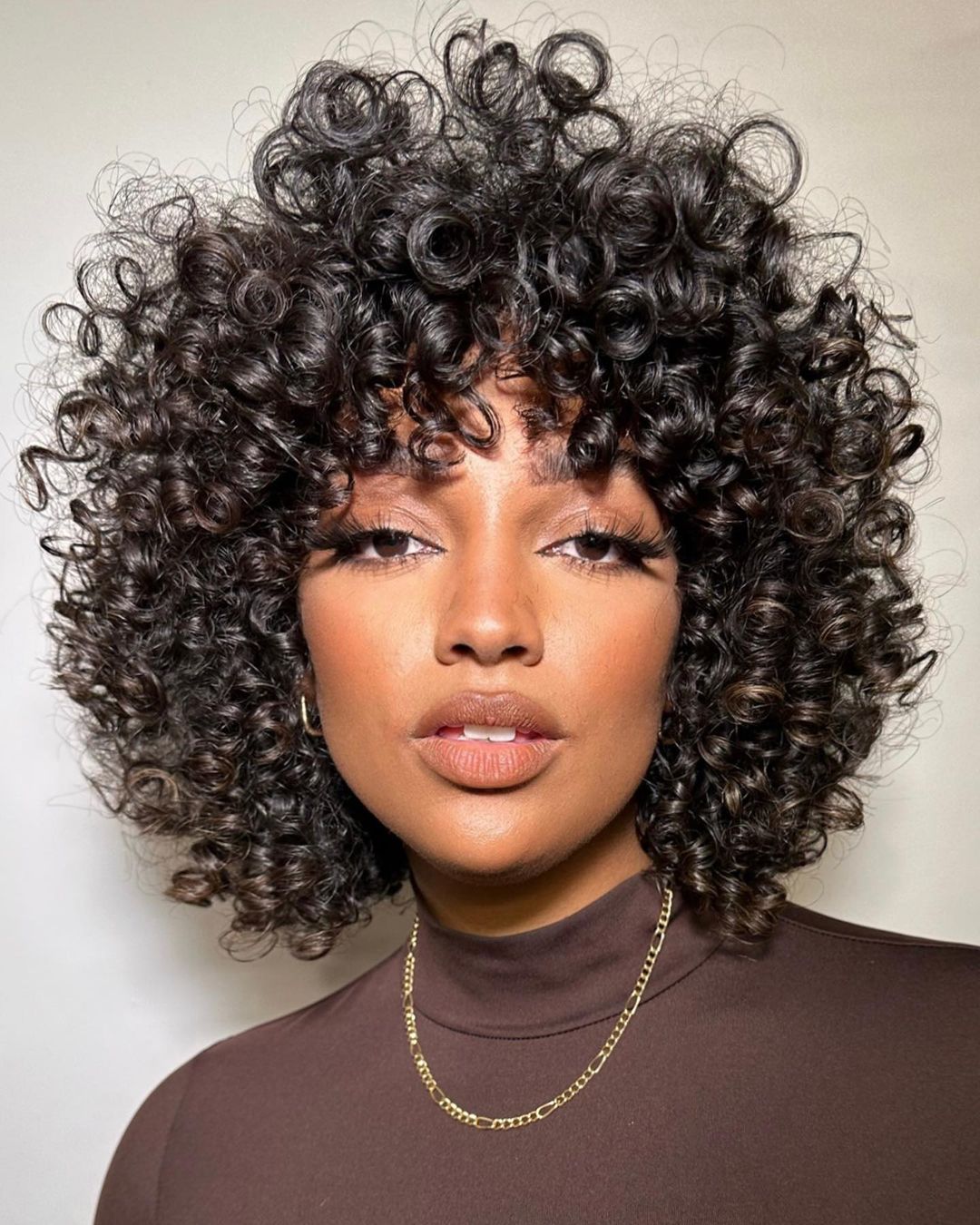 30 Cool Ways to Wear Trendy Curly Hair with Bangs in 2026 - Hair Adviser