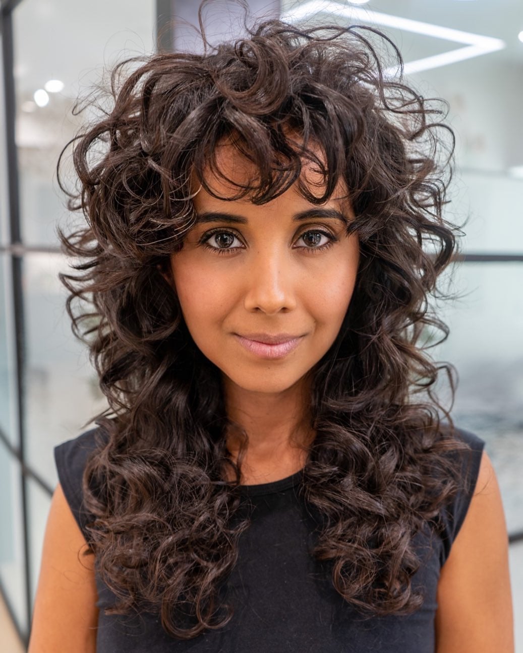 Shoulder Length Shag With Voluminous Curtain Bangs — Bangs for Curly Hair