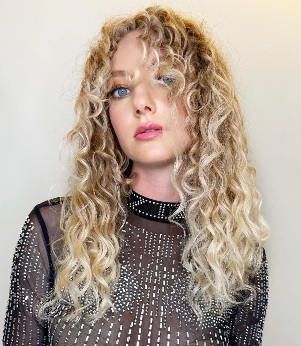 Shoulder Blonde Curly Hair With Curtain Bangs — Bangs for Curly Hair