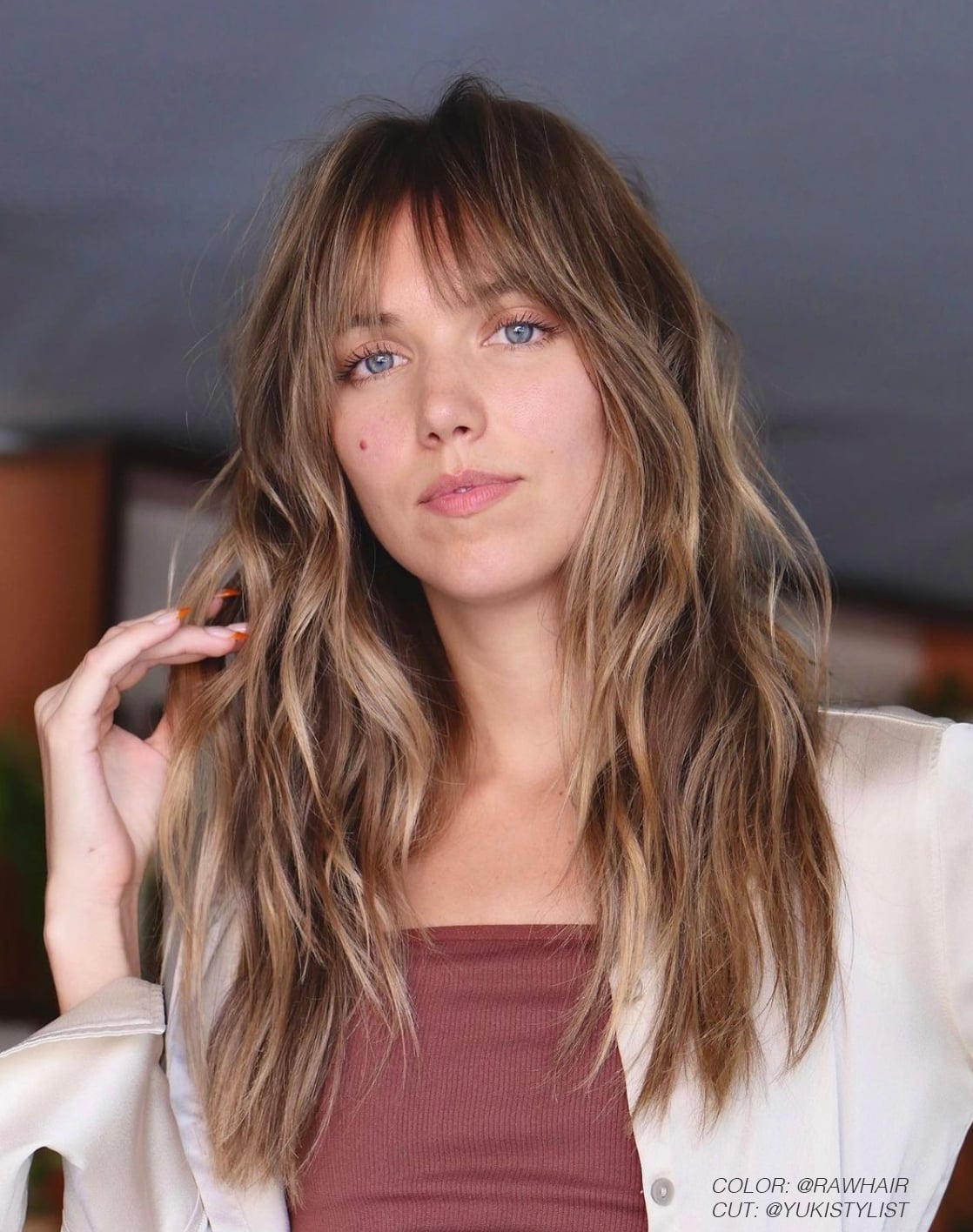 Mid-Back Layers With Wispy Bangs Mid-Back Layers With Wispy Bangs — Bangs Trends