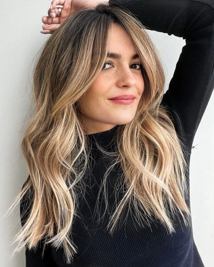 Collarbone Layers With Side-Swept Wispy Bangs Collarbone Layers With Side-Swept Wispy Bangs — Bangs Trends