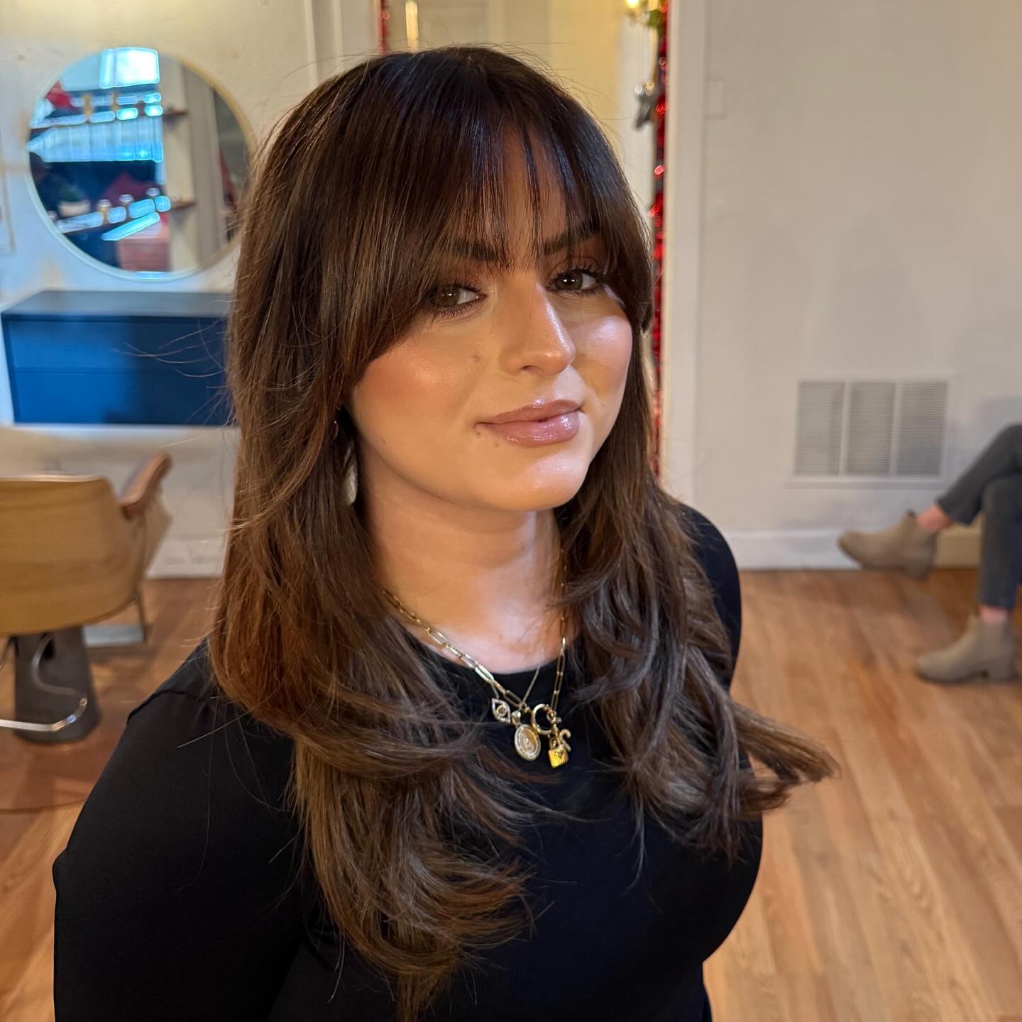 Mid-Back Layers With Long Sweeping Bangs Mid-Back Layers With Long Sweeping Bangs — Bangs Trends